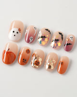 Ghostlight press-on nails in short oval shape — Playful Halloween, Pumpkin & Ghost Glitters.