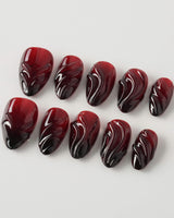 Ghoul Glam press-on nails in extra short almond shape — Dark Red & Black, 3D Liquid Flow.