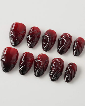 Ghoul Glam press-on nails in extra short almond shape — Dark Red & Black, 3D Liquid Flow.
