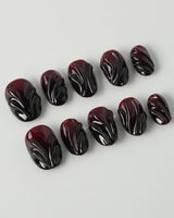 Ghoul Glam press-on nails in extra short oval shape — Dark Red & Black, 3D Liquid Flow.