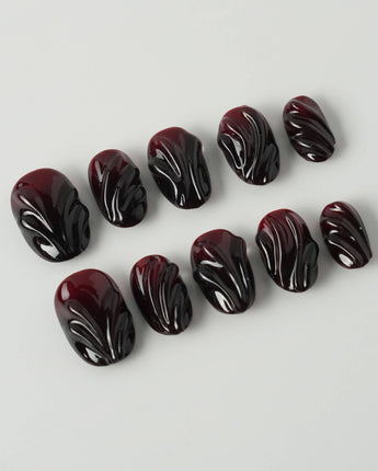 Ghoul Glam press-on nails in extra short oval shape — Dark Red & Black, 3D Liquid Flow.