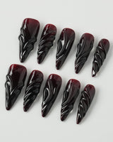 Ghoul Glam press-on nails in long stiletto shape — Dark Red & Black, 3D Liquid Flow.