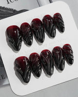 Ghoul Glam press-on nails in medium almond shape — Dark Red & Black, 3D Liquid Flow.