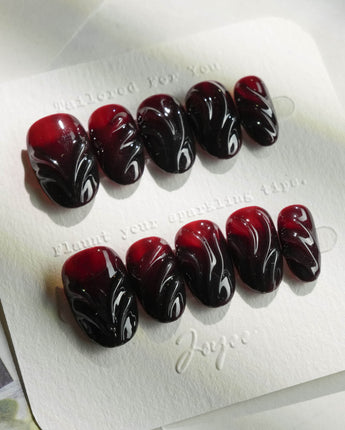 Ghoul Glam press-on nails in short oval shape — Dark Red & Black, 3D Liquid Flow.