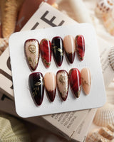 Gilded Merlot medium stiletto press-on nails with deep red and burgundy fall nail art