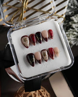 Gilded Merlot short stiletto press-on nails with deep red cat-eye and gold rose reliefs