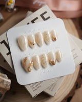 Gilded Truth nails in extra short almond — Minimalist Aurora White, Gold