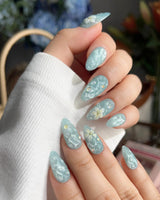 Glass Sea nail set with water-ripple cat-eye texture and sculpted flowers