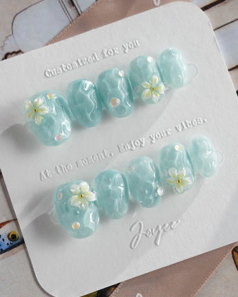 Glass Sea extra short oval nails with mermaidcore aqua ripples and 3D florals
