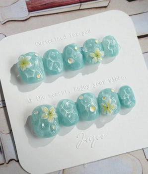 Glass Sea press-on nails in extra short squoval shape — Mint Blue Ripples, 3D Florals.