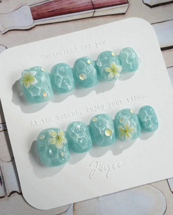 Glass Sea press-on nails in extra short squoval shape — Mint Blue Ripples, 3D Florals.
