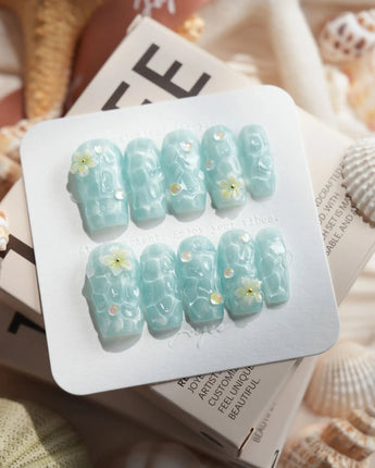 Glass Sea medium square nails with mint blue waves and glossy pearl details