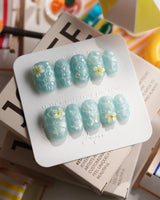 Glass Sea short coffin nails with aqua ocean ripples and floral sculpture
