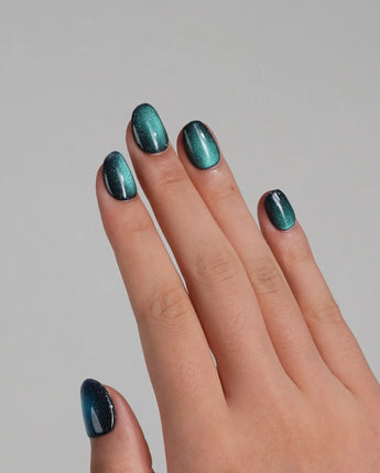 Glint Aurora handmade press-on nails featuring deep teal cat eye shimmer