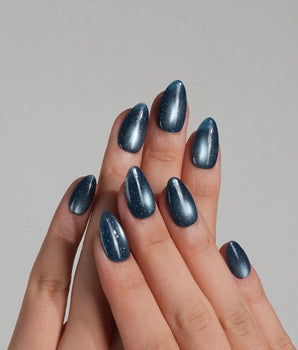 Glint Midnight press-on nail set — deep teal cat eye shimmer design, hand-painted with real gel polish