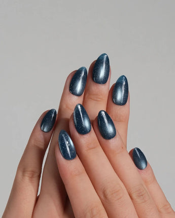 Glint Midnight press-on nail set — deep teal cat eye shimmer design, hand-painted with real gel polish