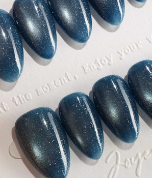 Glint Midnight handmade press-on nails featuring deep teal cat eye shimmer