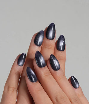 Glint Obsidian press-on nail set — deep indigo cat eye shimmer design, hand-painted with real gel polish