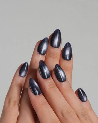 Glint Obsidian press-on nail set — deep indigo cat eye shimmer design, hand-painted with real gel polish