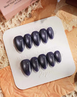 Glint Obsidian nail art close-up showing deep indigo cat eye shimmer details