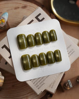 Glint Olive press-on nails in short square shape — olive green cat eye shimmer