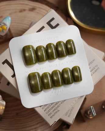 Glint Olive press-on nails in short square shape — olive green cat eye shimmer