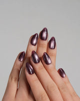 Glint Plum handmade press-on nails featuring deep plum cat eye shimmer