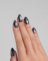 Glint Tahiti nail art close-up showing gunmetal cat eye shimmer details