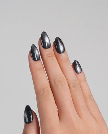 Glint Tahiti nail art close-up showing gunmetal cat eye shimmer details
