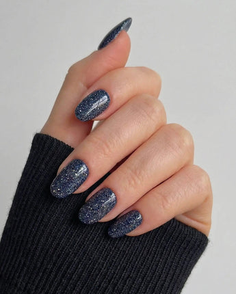 Glitter Glitz Navy nail art close-up showing deep blue cat eye glitter nails details