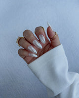 Glitz Galore handmade press-on nails featuring milky white rhinestone nails