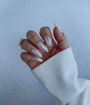 Glitz Galore handmade press-on nails featuring milky white rhinestone nails