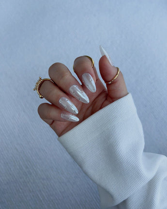 Glitz Galore handmade press-on nails featuring milky white rhinestone nails