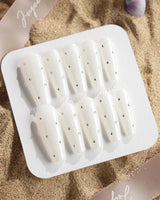 Glitz Galore press-on nails in long coffin shape — milky white rhinestone nails
