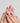 Glossy nude pink nails with golden ribbon accents