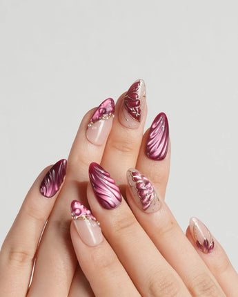 Velvet Flow press-on nails with berry red shimmer and sculpted metallic butterfly wing accents