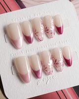 Glow Garden handmade press-on nails featuring Magenta Cat Eye, French Tips & Hand-painted Florals.