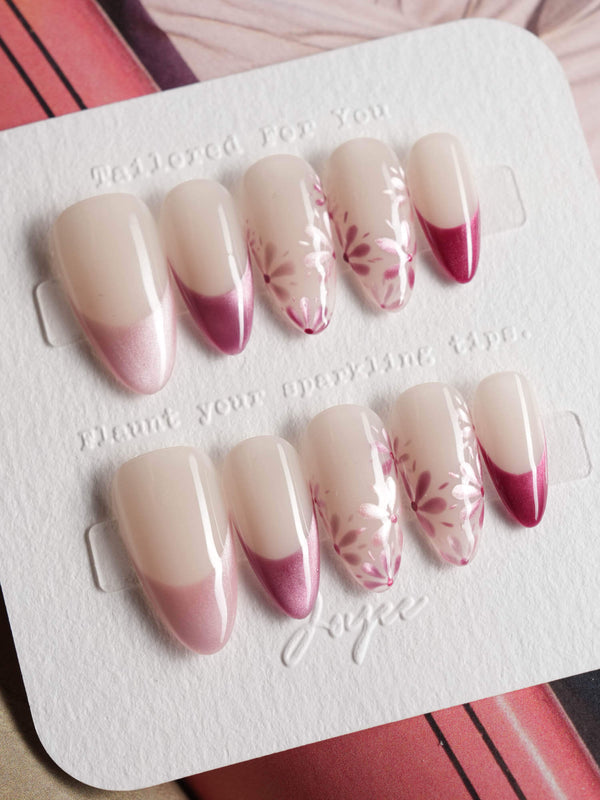 Glow Garden handmade press-on nails featuring Magenta Cat Eye, French Tips & Hand-painted Florals.