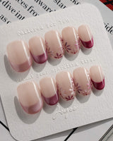 Glow Garden press-on nails in short oval shape — Magenta Cat Eye, French Tips & Hand-painted Florals.
