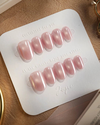 Glow Pop close-up of pearl pink chrome nails with glossy cat-eye glow