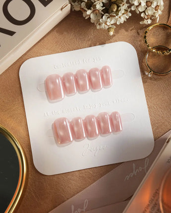 Glow Pop short almond press-ons with pearl nude pink tone and mirror chrome glow