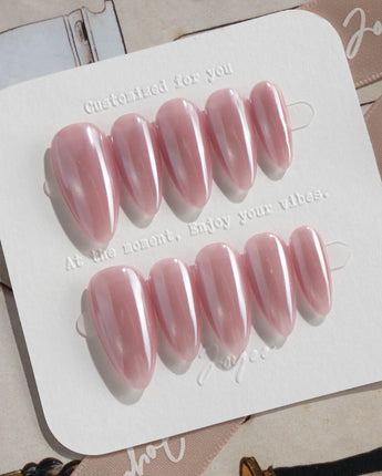Glow Pop handmade rose pink nails with reflective chrome and luminous cat-eye polish