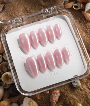 Glow Pop pearl pink nude nails with reflective chrome powder and glowing cat-eye finish