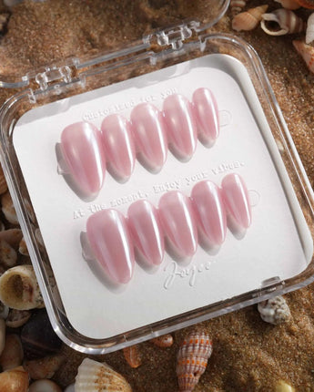 Glow Pop pearl pink nude nails with reflective chrome powder and glowing cat-eye finish