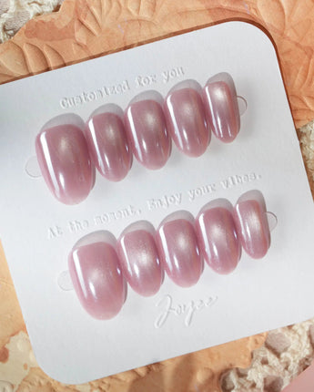 Glow Pop summer nails with glowing pink nude base and mirrored chrome finish