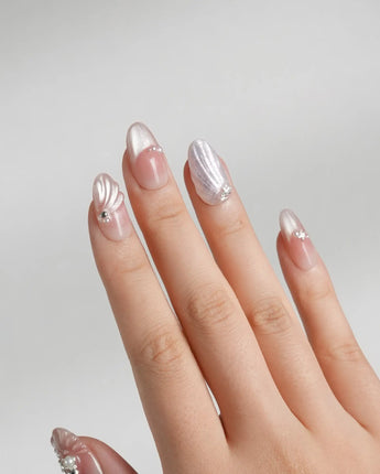 Glow Shore handmade press-on nails with sunlit wave shine and 3D sea charms