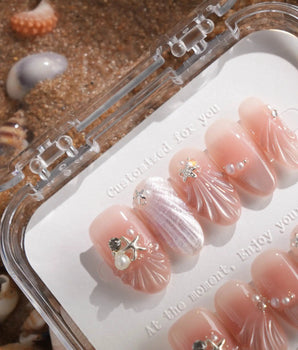 Glow Shore handmade press-on nails featuring Nude Pink Ocean Style, 3D Shells, Starfish & Pearls.