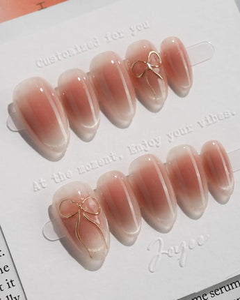 Glowing Blush press-on nails — Transparent Blush Cat Eye, Simple Silver Bow Outline. handmade nail art by Joyee Nails
