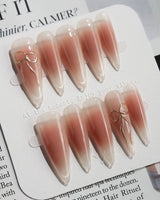 Glowing Blush press-on nails — Transparent Blush Cat Eye, Simple Silver Bow Outline. handmade nail art by Joyee Nails