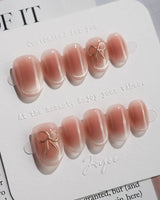 Glowing Blush press-on nails — Transparent Blush Cat Eye, Simple Silver Bow Outline. handmade nail art by Joyee Nails